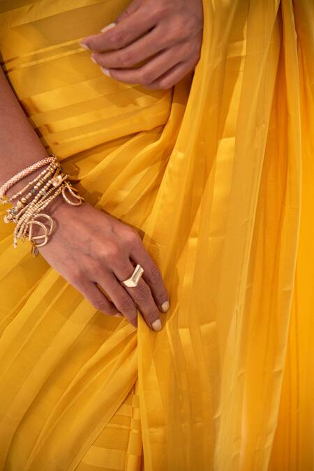 Sacred Weaves Yellow Georgette Tassels Mustard Tonal Stripe Saree at Aza Fashions Sacred Weaves_Yellow Georgette Tassels Mustard Tonal Stripe Saree_at_Aza_Fashions