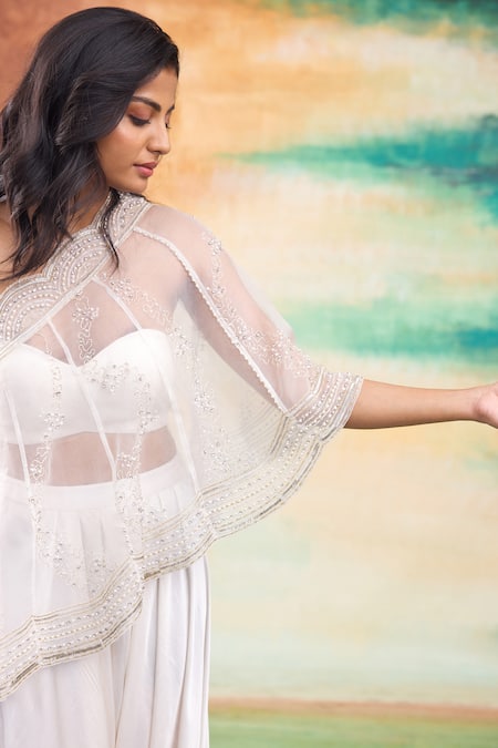 Shop SHASHA GABA Ivory Organza, Modal Cut Work Round Neck Ditsy Embroidered One Shoulder Cape Set Online at Aza Fashions Shop_SHASHA GABA_Ivory Organza, Modal Cut Work Round Neck Ditsy Embroidered One Shoulder Cape Set _Online_at_Aza_Fashions