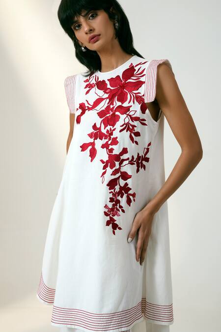 Shop Madder Much White Cotton Sequins, Embroidery Round Neck Asymmetric Floral Dress Online at Aza Fashions Shop_Madder Much_White Cotton Sequins, Embroidery Round Neck Asymmetric Floral Dress _Online_at_Aza_Fashions