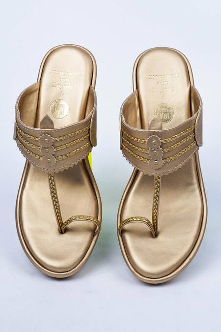 Shop Irasoles Gold Braided Kolhapuri Wedges at Aza Fashions Shop_Irasoles_Gold Braided Kolhapuri Wedges_at_Aza_Fashions