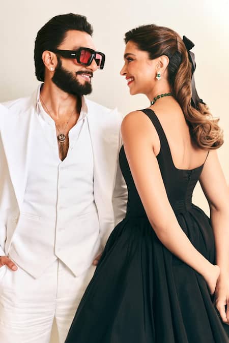 Gauri & Nainika_Black Taffeta Plunge Neck Pleated Waist Gown _Online_at_Aza_Fashions