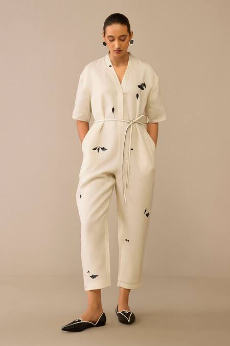 Ampm_Ivory Linen, Faux Leather Brooches, Embroidery Placed Flower Pattern Jumpsuit_Online_at_Aza_Fashions