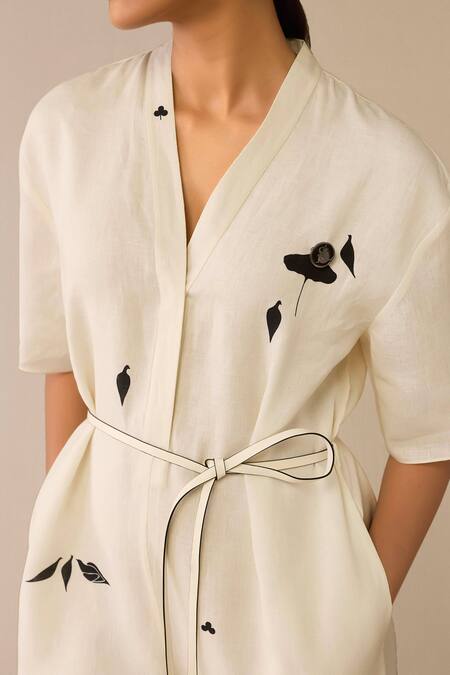 Buy_Ampm_Ivory Linen, Faux Leather Brooches, Embroidery Placed Flower Pattern Jumpsuit_Online_at_Aza_Fashions