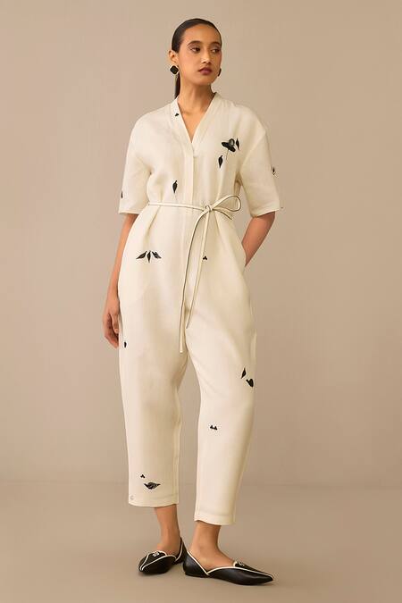 Ampm_Ivory Linen, Faux Leather Brooches, Embroidery Placed Flower Pattern Jumpsuit_at_Aza_Fashions