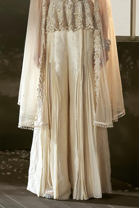 Nitika Gujral_Cream Georgette, Organza, Net Embroidery, Crystals, Peplum Top And Sharara Set _at_Aza_Fashions