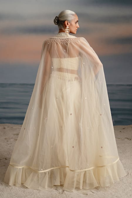 Shop Shashank Arya Ivory Organza, Satin, Lycra Pearls, Seashell Embellished Cape Dhoti Skirt Set at Aza Fashions Shop_Shashank Arya_Ivory Organza, Satin, Lycra Pearls, Seashell Embellished Cape Dhoti Skirt Set _at_Aza_Fashions