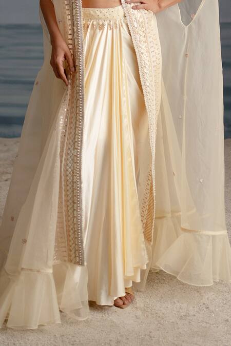 Shashank Arya Ivory Organza, Satin, Lycra Pearls, Seashell Embellished Cape Dhoti Skirt Set Online at Aza Fashions Shashank Arya_Ivory Organza, Satin, Lycra Pearls, Seashell Embellished Cape Dhoti Skirt Set _Online_at_Aza_Fashions