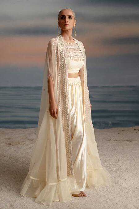 Buy Shashank Arya Ivory Organza, Satin, Lycra Pearls, Seashell Embellished Cape Dhoti Skirt Set Online at Aza Fashions Buy_Shashank Arya_Ivory Organza, Satin, Lycra Pearls, Seashell Embellished Cape Dhoti Skirt Set _Online_at_Aza_Fashions