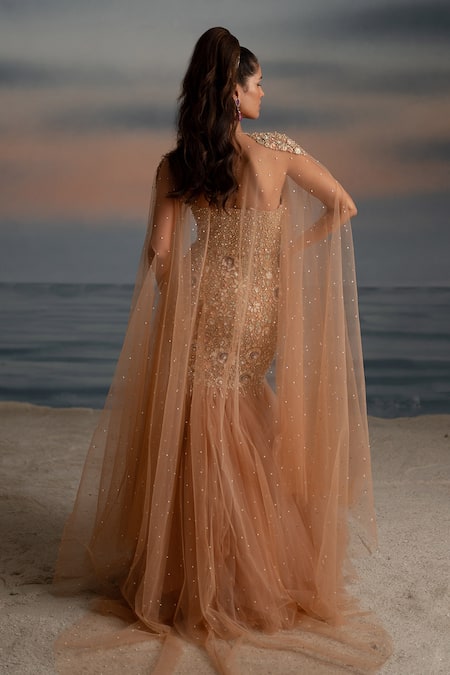 Shop Shashank Arya Beige Tulle, Satin Pearls, Stones, Embellished Fish-cut Gown With Sheer Cape at Aza Fashions Shop_Shashank Arya_Beige Tulle, Satin Pearls, Stones, Embellished Fish-cut Gown With Sheer Cape _at_Aza_Fashions