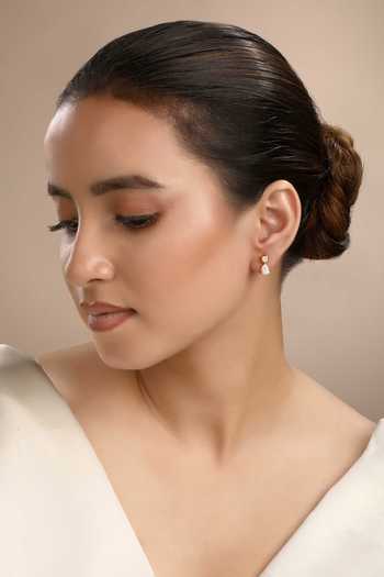 Buy Sica Jewellery White Crystals Cubic Zirconia Pebble Stud Earrings at Aza Fashions Buy_Sica Jewellery_White Crystals Cubic Zirconia Pebble Stud Earrings _at_Aza_Fashions