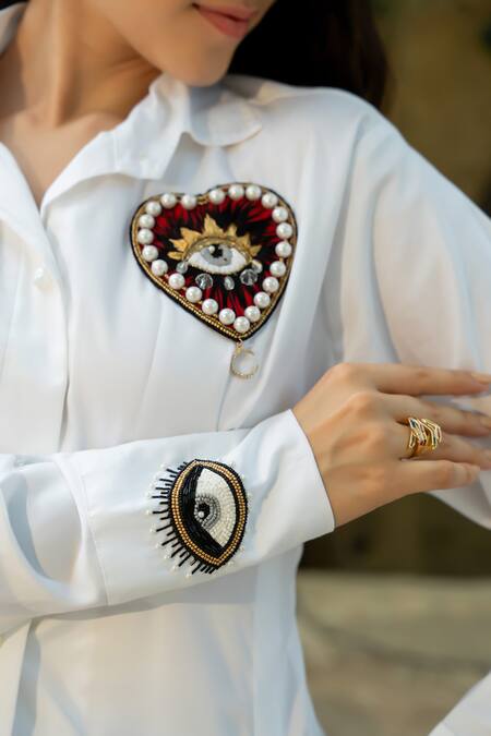 Zilaire White Cotton Embroidery, Beads Collared Heart And Eye Embellished Shirt Dress Online at Aza Fashions Zilaire_White Cotton Embroidery, Beads Collared Heart And Eye Embellished Shirt Dress _Online_at_Aza_Fashions