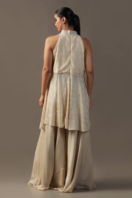 Shop Two Sisters By Gyans Ivory Georgette Sequins, Embroidery Halter Neck Peplum Kurta Set at Aza Fashions Shop_Two Sisters By Gyans_Ivory Georgette Sequins, Embroidery Halter Neck Peplum Kurta Set _at_Aza_Fashions