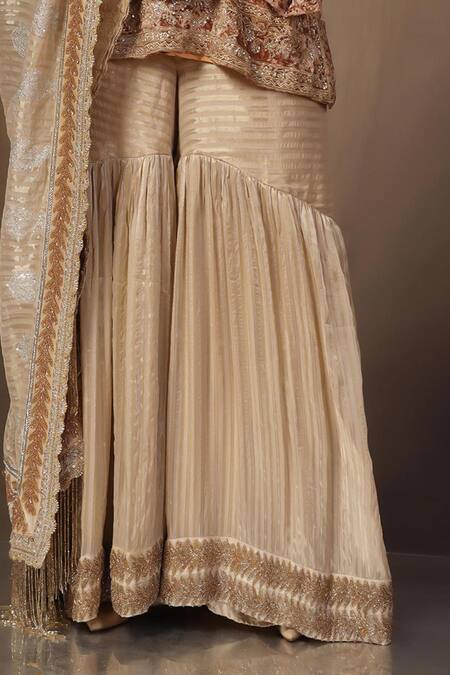 tara thakur_Gold Tissue, Brocade Embroidery, Sequins, Zari V-neck Zardozi Top And Sharara Set _Online_at_Aza_Fashions