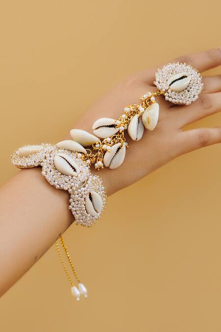 Kanyaadhan By Dhirajaayushi Cream Beads, Pearls Cowrie Shell Embellished Jewellery Set at Aza Fashions Kanyaadhan By Dhirajaayushi_Cream Beads, Pearls Cowrie Shell Embellished Jewellery Set _at_Aza_Fashions