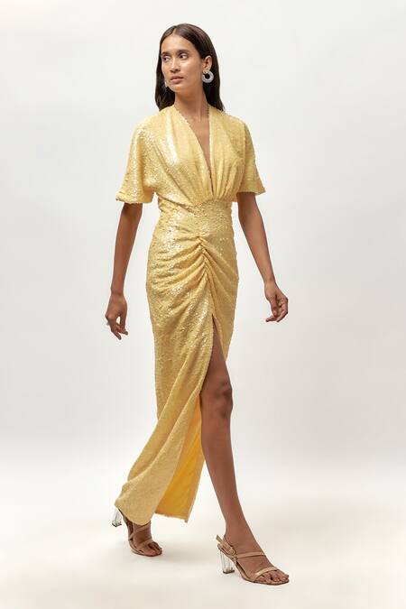 Emblaze Yellow Net, Linen Sequins V-neck Ruched Front Slit Maxi Dress Online at Aza Fashions Emblaze_Yellow Net, Linen Sequins V-neck Ruched Front Slit Maxi Dress _Online_at_Aza_Fashions