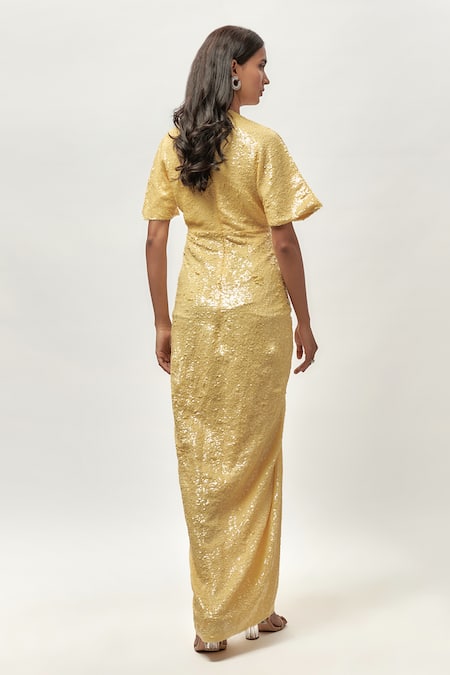 Shop Emblaze Yellow Net, Linen Sequins V-neck Ruched Front Slit Maxi Dress at Aza Fashions Shop_Emblaze_Yellow Net, Linen Sequins V-neck Ruched Front Slit Maxi Dress _at_Aza_Fashions