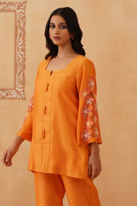 Rishika Singh_Orange Chanderi Beads Round Neck Bloom Short Kurta Set _at_Aza_Fashions