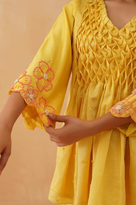 Buy_Rishika Singh_Yellow Chanderi Beads, Embroidery V-neck Honeycomb Smocked Peplum Kurta Set 