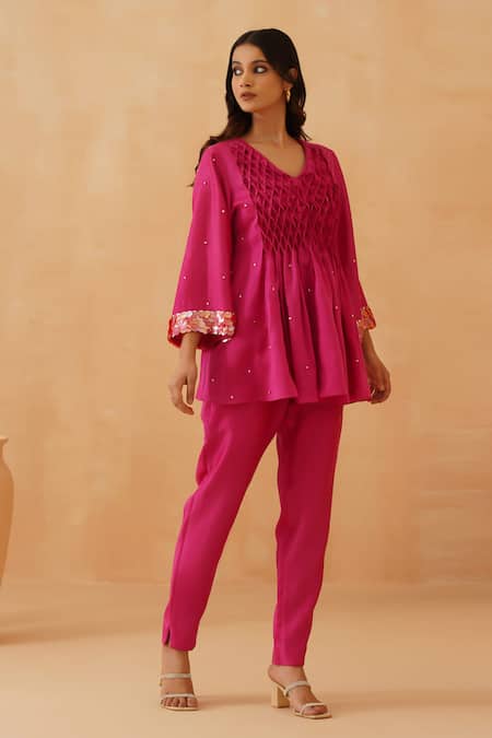 Rishika Singh_Pink Chanderi Beads V-neck Honeycomb Smocked Yoke Peplum Kurta Set _Online_at_Aza_Fashions