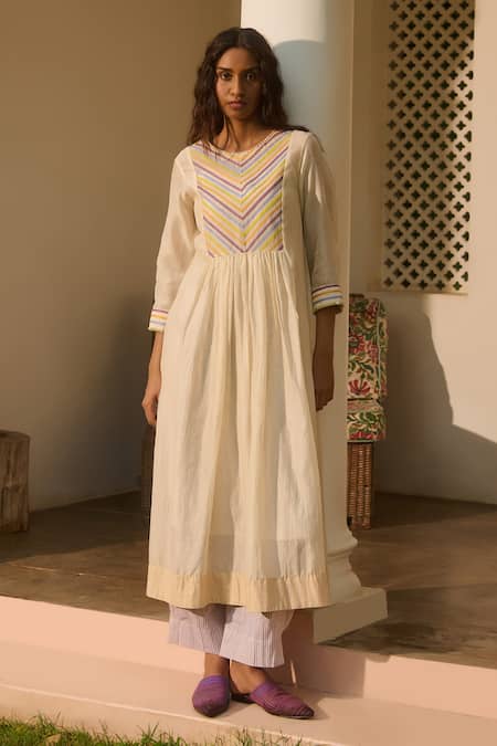 Swatti Kapoor Ivory Chanderi, Cotton Beads Round Neck Stripe Patchwork Woven Tunic Online at Aza Fashions Swatti Kapoor_Ivory Chanderi, Cotton Beads Round Neck Stripe Patchwork Woven Tunic _Online_at_Aza_Fashions