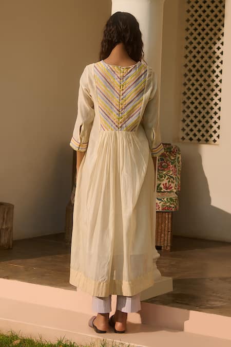 Shop Swatti Kapoor Ivory Chanderi, Cotton Beads Round Neck Stripe Patchwork Woven Tunic at Aza Fashions Shop_Swatti Kapoor_Ivory Chanderi, Cotton Beads Round Neck Stripe Patchwork Woven Tunic _at_Aza_Fashions
