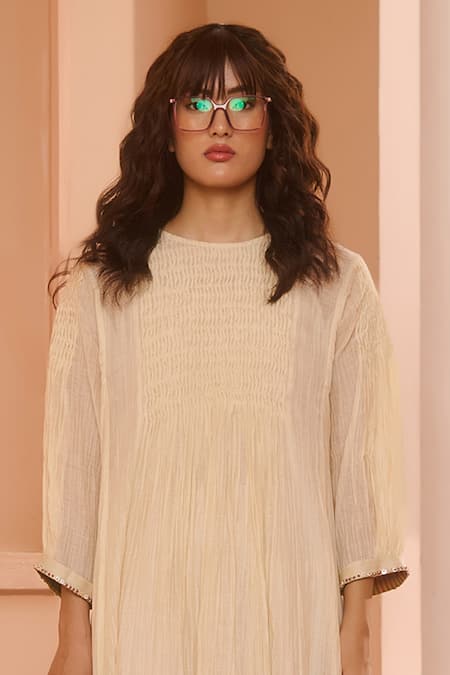 Shop Swatti Kapoor Ivory Chanderi, Cotton Sequins Round Neck Pintuck Panel Kurta Set at Aza Fashions Shop_Swatti Kapoor_Ivory Chanderi, Cotton Sequins Round Neck Pintuck Panel Kurta Set _at_Aza_Fashions