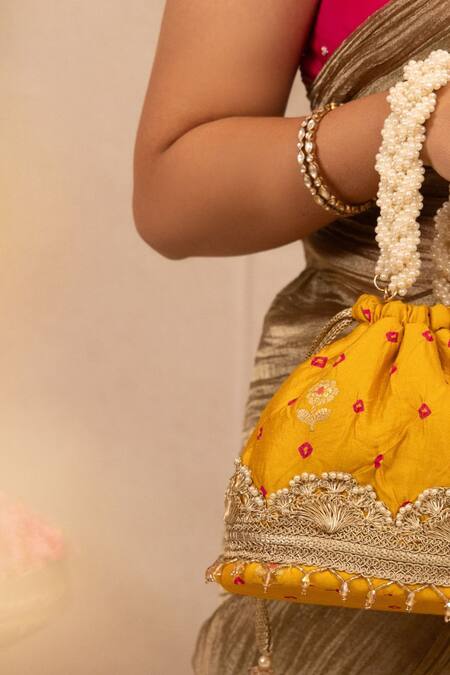 Amyra Yellow Lace, Pearls Embellished Bandhani Bucket Bag Online at Aza Fashions Amyra_Yellow Lace, Pearls Embellished Bandhani Bucket Bag _Online_at_Aza_Fashions