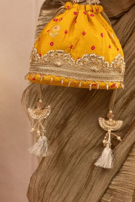 Shop Amyra Yellow Lace, Pearls Embellished Bandhani Bucket Bag Online at Aza Fashions Shop_Amyra_Yellow Lace, Pearls Embellished Bandhani Bucket Bag _Online_at_Aza_Fashions