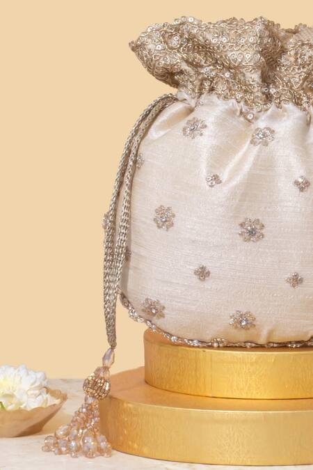 Shop Amyra Beige Embroidery, Crystals Tassel Potli Bag Online at Aza Fashions Shop_Amyra_Beige Embroidery, Crystals Tassel Potli Bag_Online_at_Aza_Fashions