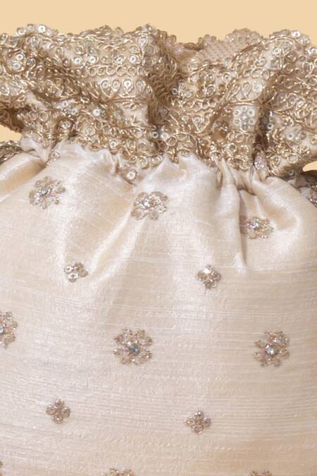 Amyra Beige Embroidery, Crystals Tassel Potli Bag at Aza Fashions Amyra_Beige Embroidery, Crystals Tassel Potli Bag_at_Aza_Fashions
