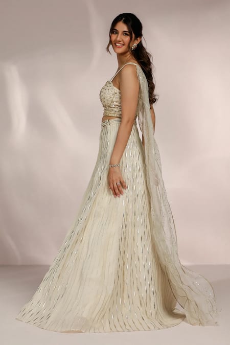Label Moni K Ivory Organza Sequins, Cut Work, Embroidery Sweetheart Hand Stripe Lehenga Set Online at Aza Fashions Label Moni K_Ivory Organza Sequins, Cut Work, Embroidery Sweetheart Hand Stripe Lehenga Set _Online_at_Aza_Fashions