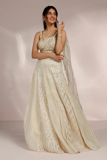 Buy Label Moni K Ivory Organza Sequins, Cut Work, Embroidery Sweetheart Hand Stripe Lehenga Set Online at Aza Fashions Buy_Label Moni K_Ivory Organza Sequins, Cut Work, Embroidery Sweetheart Hand Stripe Lehenga Set _Online_at_Aza_Fashions