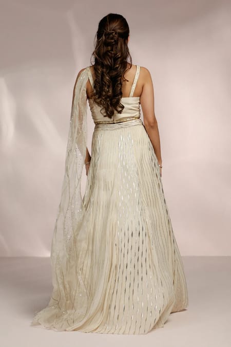 Shop Label Moni K Ivory Organza Sequins, Cut Work, Embroidery Sweetheart Hand Stripe Lehenga Set at Aza Fashions Shop_Label Moni K_Ivory Organza Sequins, Cut Work, Embroidery Sweetheart Hand Stripe Lehenga Set _at_Aza_Fashions