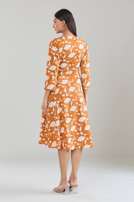 Shop Samyukta Singhania Orange Cotton V-neck Floral Hand Block Printed Midi Dress at Aza Fashions Shop_Samyukta Singhania_Orange Cotton V-neck Floral Hand Block Printed Midi Dress_at_Aza_Fashions
