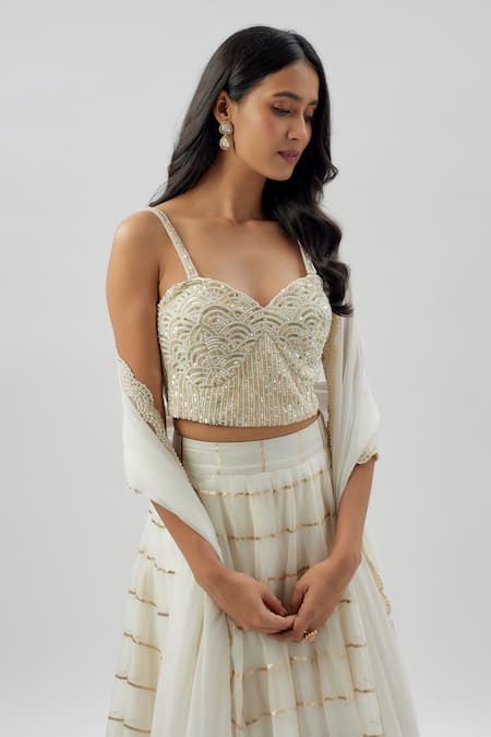 Divya Kanakia_Ivory Organza Sequins, Beads, Stripes Apsara Pattern Lehenga Corset Set _Online_at_Aza_Fashions
