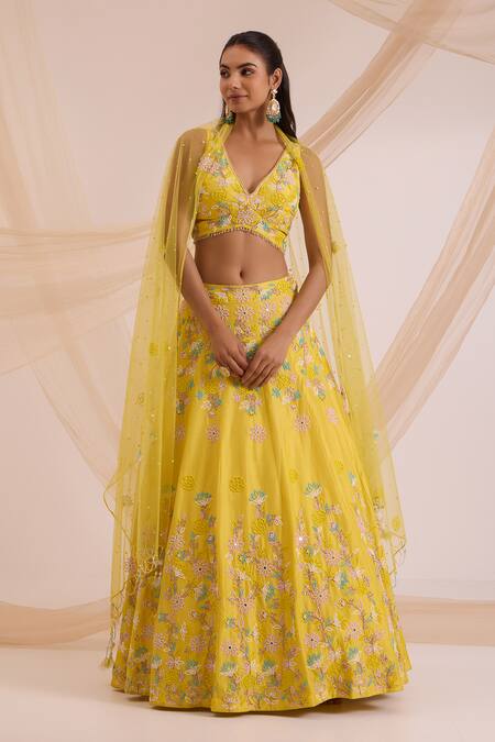 Nitisha Kashyap Official_Yellow Silk, Net Embroidery, Beads V-neck Floral Lehenga Set _Online_at_Aza_Fashions