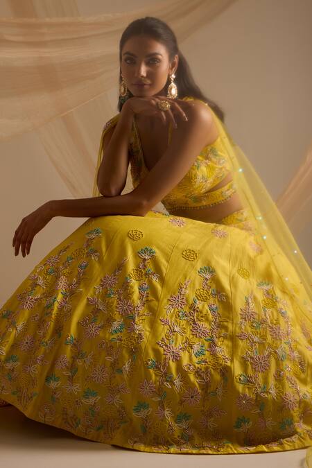 Nitisha Kashyap Official_Yellow Silk, Net Embroidery, Beads V-neck Floral Lehenga Set _at_Aza_Fashions