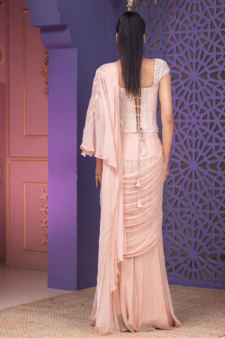 Shop Nidhi Kejriwal Pink Chiffon, Chandelier, Stone Embroidered Pre-draped Saree With Corset Blouse at Aza Fashions Shop_Nidhi Kejriwal_Pink Chiffon, Chandelier, Stone Embroidered Pre-draped Saree With Corset Blouse _at_Aza_Fashions
