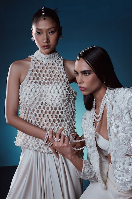 Shop_Istya_Ivory Net, Satin Pearls, Sequins, Beads Halter Embroidered Top Draped Skirt Set _Online_at_Aza_Fashions