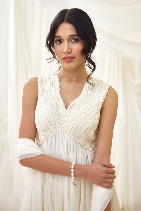 Buy Lavanya Ahuja Ivory Georgette Pearls, Tassels Collared Embroidered Peplum Tunic Sharara Set Buy_Lavanya Ahuja_Ivory Georgette Pearls, Tassels Collared Embroidered Peplum Tunic Sharara Set