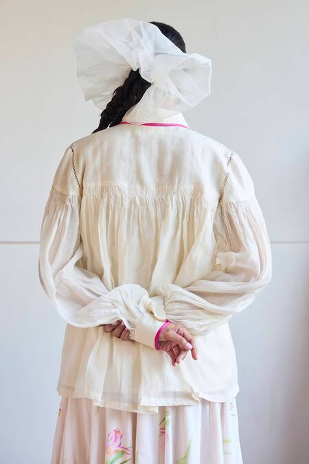 Shop Juanita By Shubhda Ivory Chanderi Collared Smocked Detail Balloon Sleeve Shirt at Aza Fashions Shop_Juanita By Shubhda_Ivory Chanderi Collared Smocked Detail Balloon Sleeve Shirt _at_Aza_Fashions
