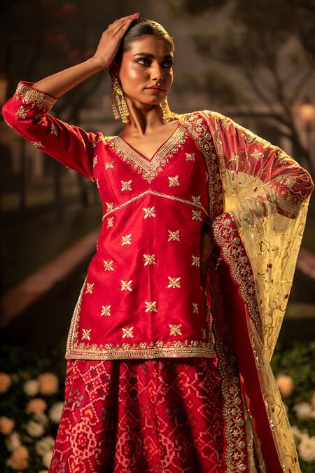 Shop_Bandhani_Red Silk Beads, Gota Patti, Lace V-neck Patola Embroidered Lehenga Kurta Set _Online_at_Aza_Fashions