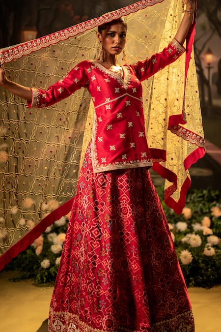 Bandhani_Red Silk Beads, Gota Patti, Lace V-neck Patola Embroidered Lehenga Kurta Set _at_Aza_Fashions