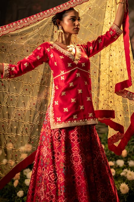 Shop_Bandhani_Red Silk Beads, Gota Patti, Lace V-neck Patola Embroidered Lehenga Kurta Set 