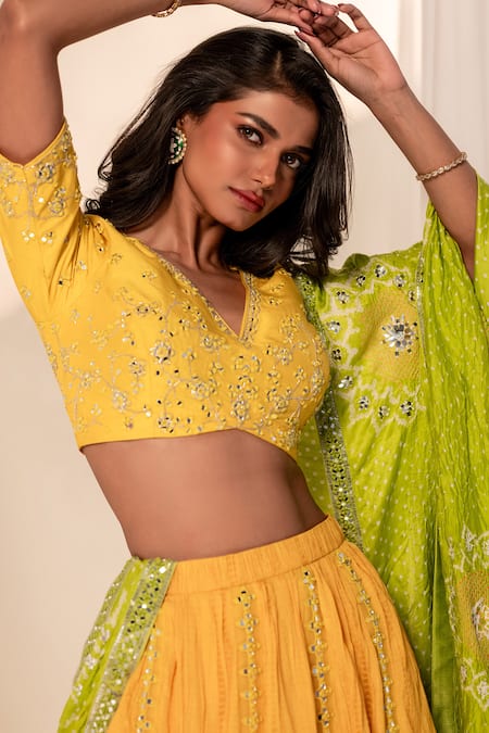 Bandhani_Yellow Silk Mirrors, Embroidery V-neck Floral Lehenga Set _at_Aza_Fashions