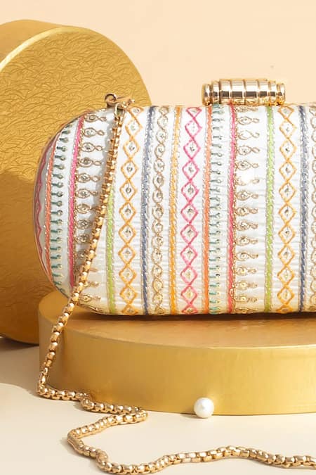 Buy Amyra Off White Embroidery Woven Capsule Clutch Online at Aza Fashions Buy_Amyra_Off White Embroidery Woven Capsule Clutch _Online_at_Aza_Fashions