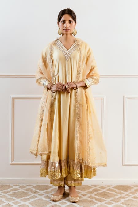 Shop Rivaaj Clothing Beige Modal, Silk Gota Patti, Sequins, Zari V-neck Embroidered Anarkali Set Online at Aza Fashions Shop_Rivaaj Clothing_Beige Modal, Silk Gota Patti, Sequins, Zari V-neck Embroidered Anarkali Set _Online_at_Aza_Fashions