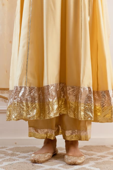 Rivaaj Clothing Beige Modal, Silk Gota Patti, Sequins, Zari V-neck Embroidered Anarkali Set at Aza Fashions Rivaaj Clothing_Beige Modal, Silk Gota Patti, Sequins, Zari V-neck Embroidered Anarkali Set _at_Aza_Fashions