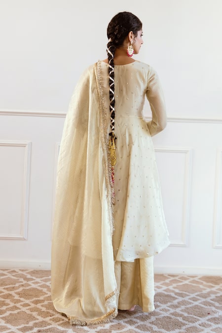 Shop Rivaaj Clothing Ivory Silk, Tissue Sequins, Embroidery Round Neck Stripe Woven Anarkali Set at Aza Fashions Shop_Rivaaj Clothing_Ivory Silk, Tissue Sequins, Embroidery Round Neck Stripe Woven Anarkali Set_at_Aza_Fashions