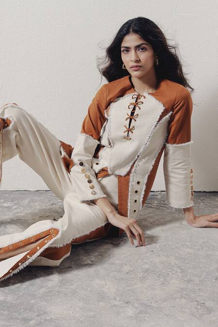 Buy Veera Wear Ivory Denim Split V-neck Lace-up Rivet Detail Top Online at Aza Fashions Buy_Veera Wear_Ivory Denim Split V-neck Lace-up Rivet Detail Top _Online_at_Aza_Fashions